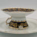 This is looking directly at the side, which shows the details of the outer edge of the cup and saucer. This is looking directly at the side, which shows the details of the outer edge of the cup and saucer.